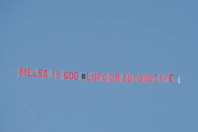 The man behind the banner flying over Elland Road this afternoon (Friday) says it is time to believe more than ever after the team's 2-1 loss to Wigan Athletic.