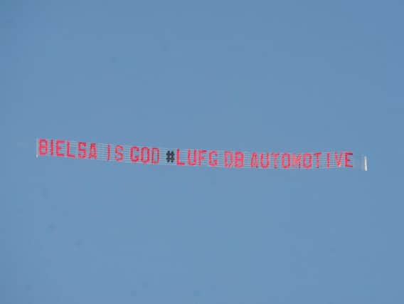 The man behind the banner flying over Elland Road this afternoon (Friday) says it is time to believe more than ever after the team's 2-1 loss to Wigan Athletic.