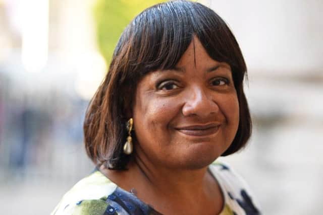 The MP has apologised after being photographed with a mojito in a can drink on a train in London
