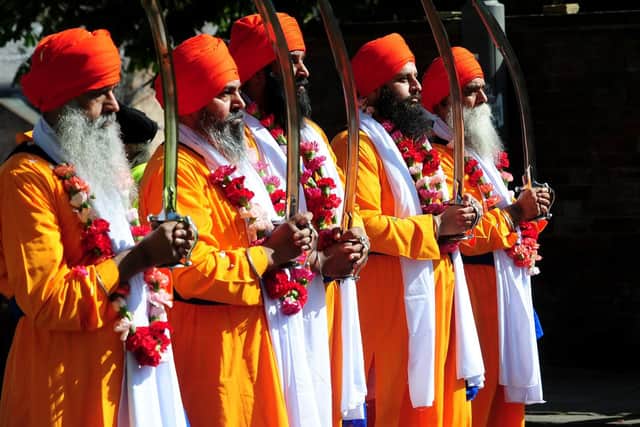 Sikh men wearing traditional clothes to celebrate Vaisakhi in Leeds