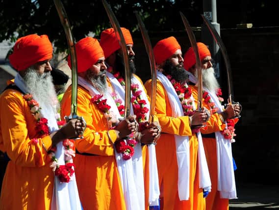 Sikh men wearing traditional clothes to celebrate Vaisakhi in Leeds