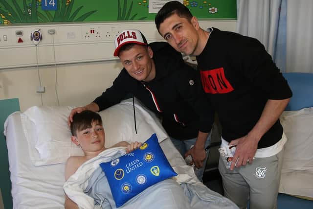 Leeds United players Pablo Hernandez and Gjanni Alioski spread some cheer at Leeds Children's Hospital.