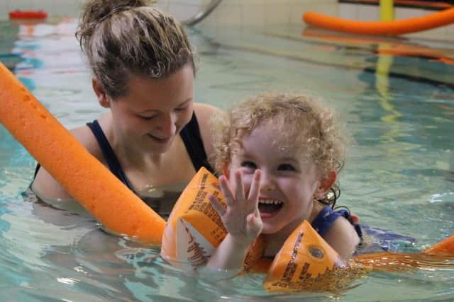 SPLASH: A young girl enjoys swimming at one of SNAPS hydrotherapy sessions.