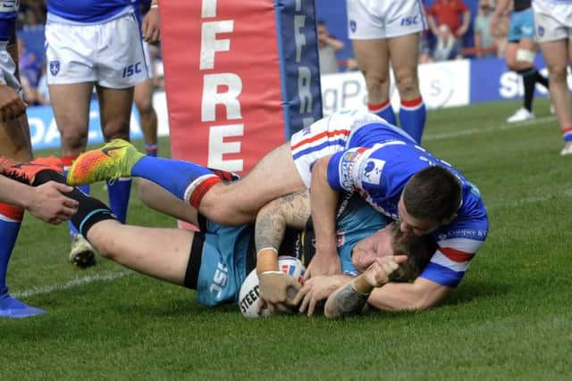 Liam Sutcliffe, touching down, was one of Leeds Rhinos' better performers against Wakefield Trinity. PIC: Simon Hulme