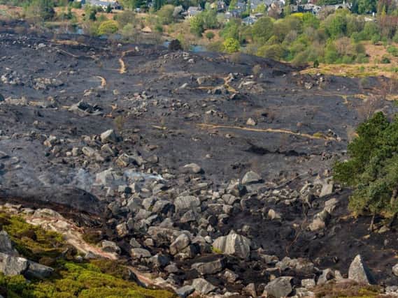 Firefighters continue to damp down following a moorland fire on Ilkley Moor. It came as crews battled a much larger blaze on Marsden Moor - caused by a barbecue.