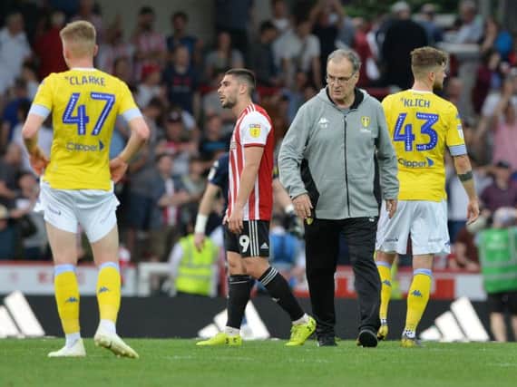 Leeds United head coach greets his players at full-time following Brentford defeat.