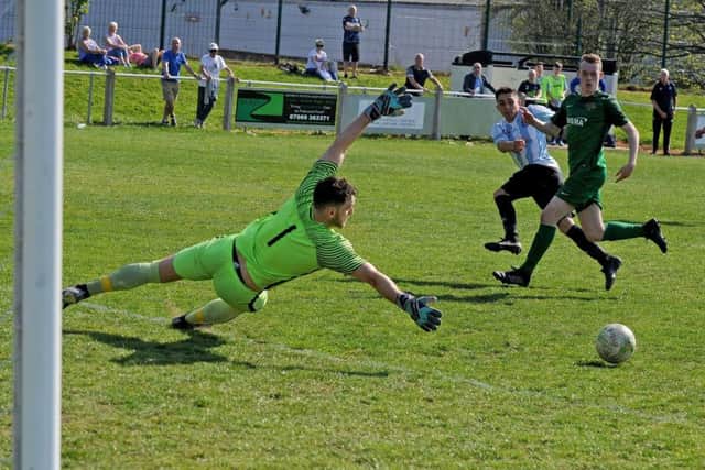 Reece Fennell shoots for Carlton but his shot goes wide as Beeston goalkeeper Stehen Kerr has it covered. PIC: Steve Riding