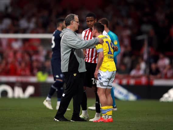 PAIN: Leeds United head coach Marcelo Bielsa goes to comfort a very upset Pablo Hernandez following Monday's 2-0 loss at Brentford.
