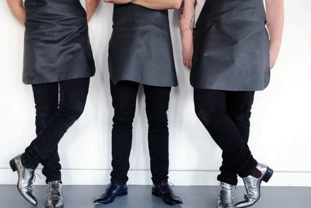 The Man Behind The Curtain.
Chefs in their silver boots.
17th July 2014. Picture Jonathan Gawthorpe.