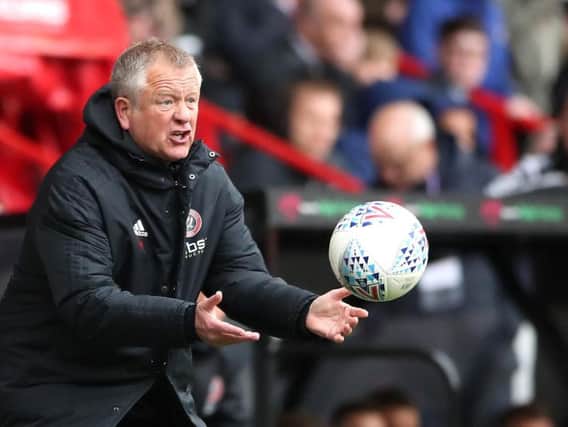 Chris Wilder launches the ball back onto the field during Sheffield United's win over Ipswich Town.
