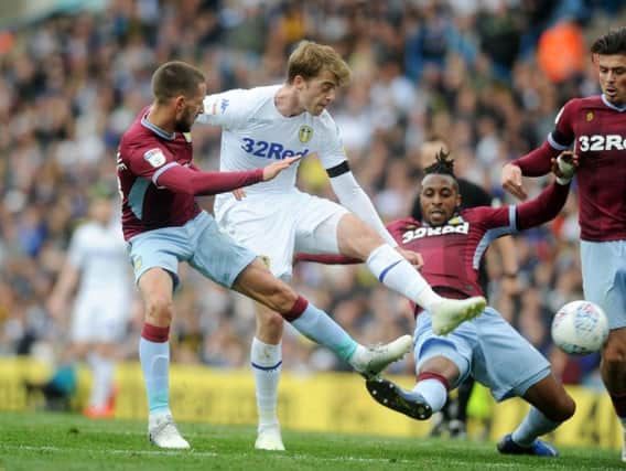 SPICY: Tackles flew in between Leeds United and Aston Villa with Patrick Bamford challenging Jonathan Kodjia.