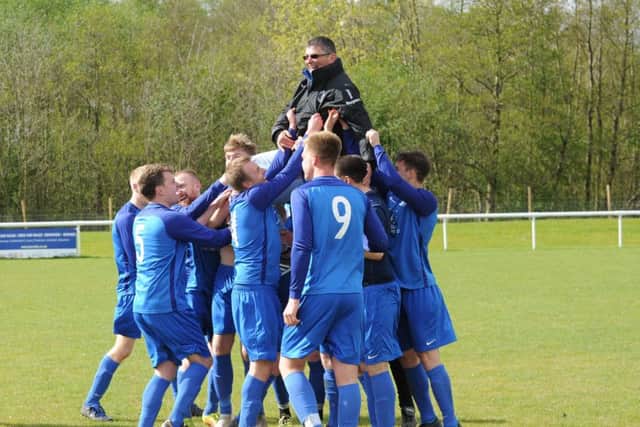 Boroughbridge players celebrate with manager Daz Ekin. PIC: Steve Riding