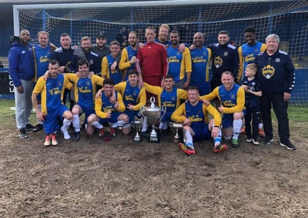 Hope Inn Whites after winning the Sanford Cup. They also won the Leeds and District Sunday Cup and the Jubilee Premier League and were unbeaten all season in the Leeds Combination League.