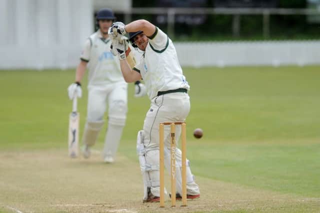 New Farnley's
Steve Bullen watches the ball clear his stumps in a game against Woodlands that was eventually abandoned. PIC: Steve Riding