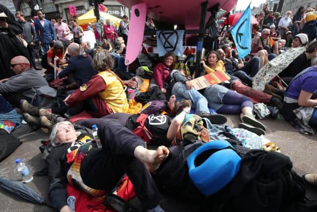 Climate activists surround a pink boat that has been parked during an Extinction Rebellion demonstration at Oxford Circus, London (Photo: Yui Mok/PA Wire)