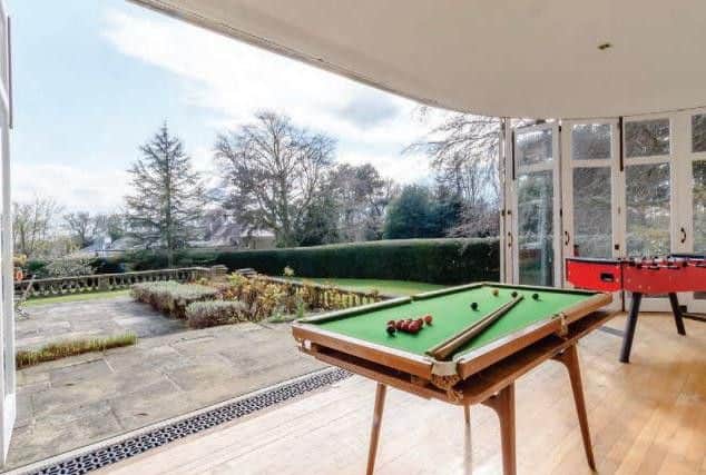 Boasts full-width folding glazed doors truly bringing the outdoors in.