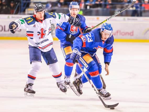 TOUGH TEST: Jonathan Phillips, left, in action against Slovakia in Poprad on Saturday afternoon. Picture: Andrej Galica.