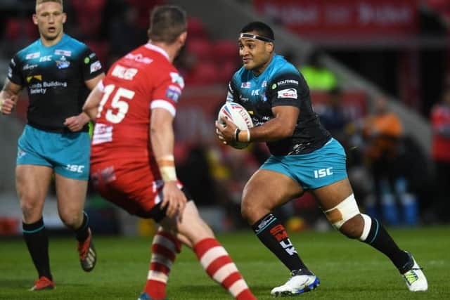Ava Seumanufagai drives forward against Salford Red Devils.
