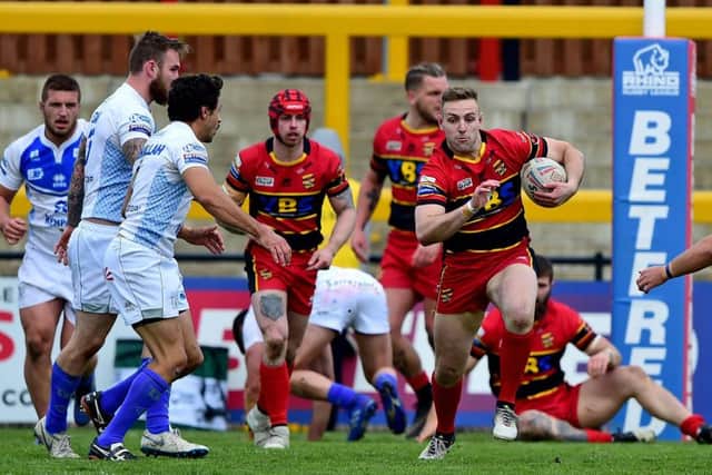 Toby Richardson breaks away for Dewsbury against Toulouse.