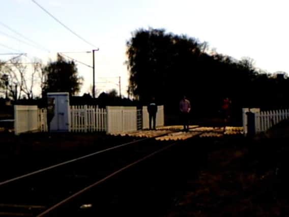 Young people loiteringon the Castle Hills level crossing in Northallerton.