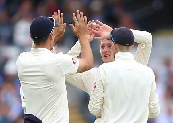 Dom Bess, centre, celebrates after taking the wicket of Pakistan's Usman Salahuddin during England's Test at Headingley last June (Picture: Nigel French/PA Wire).