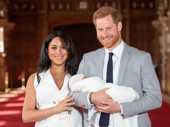 Prince Harry and Meghan Markle have unveiled their baby to the world. Photos: PA