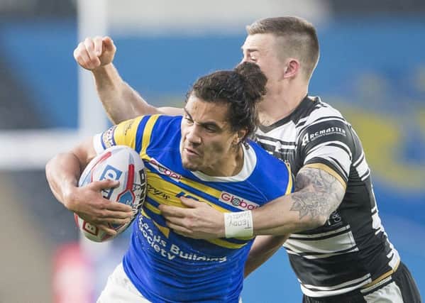 Ashton Golding is tackled by Hull FC's Jamie Shaul.