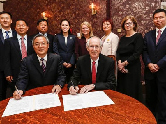 Councillor Peter Box and Mayor Zhou Hongbo sign the friendship agreement on Thursday morning.