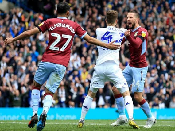 Leeds United and Aston Villa clash after controversial goal at Elland Road.