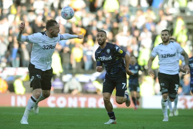 Leeds United's Kemar Roofe chases down Richard Keogh. Picture: Tony Johnson.