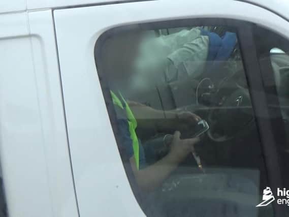 A van driver was also spotted with no hands on the wheel as he used one hand to change gear and the other to hold his mobile phone.