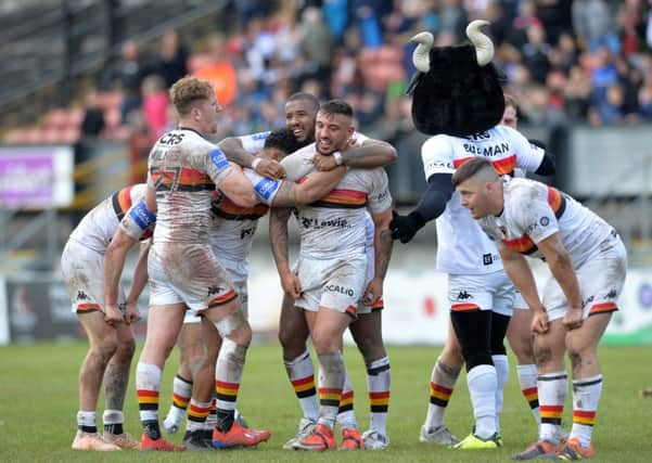 Bradford Bulls' players celebrate at the final whistle after beating Leeds Rhinos 24-22.  Picture: Bruce Rollinson