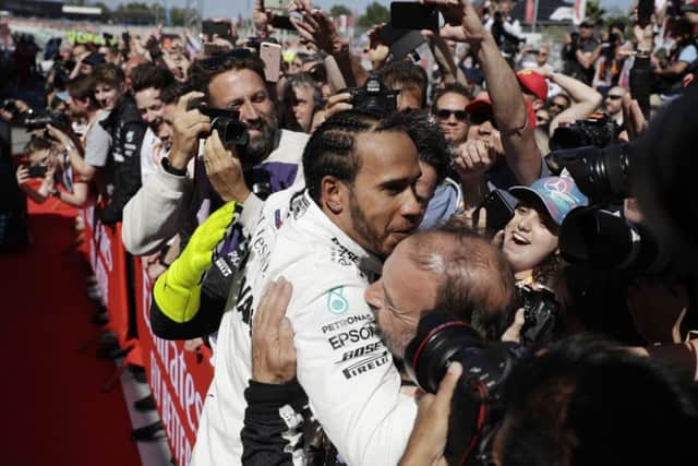 Mercedes driver Lewis Hamilton of Britain celebrates after winning the Spanish Grand Prix. Picture: AP/Emilio Morenatti.