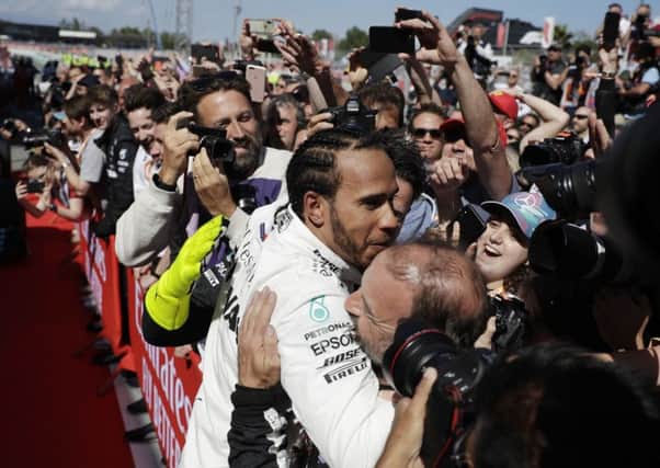 Mercedes driver Lewis Hamilton of Britain celebrates after winning the Spanish Grand Prix. Picture: AP/Emilio Morenatti.