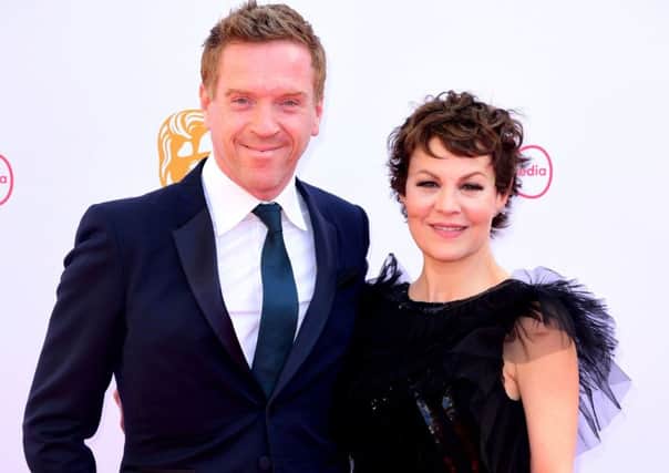 CELEBRITY POWER COUPLE: 
Clever pairing - Damian Lewis in midnight blue and Helen McCrory in black lace at the Virgin Media BAFTA TV awards, held at the Royal Festival Hall in London. Ian West/PA Wire