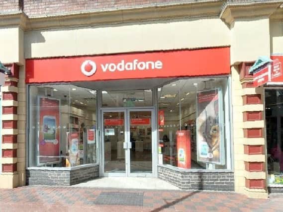 Vodafone has cuts its shareholder dividend payout.