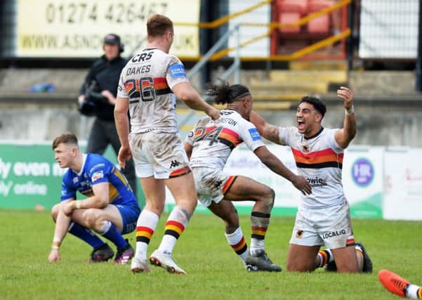 Bradford Bulls players celebrate at the final hooter after beating Leeds Rhinos in the Challenge Cup.