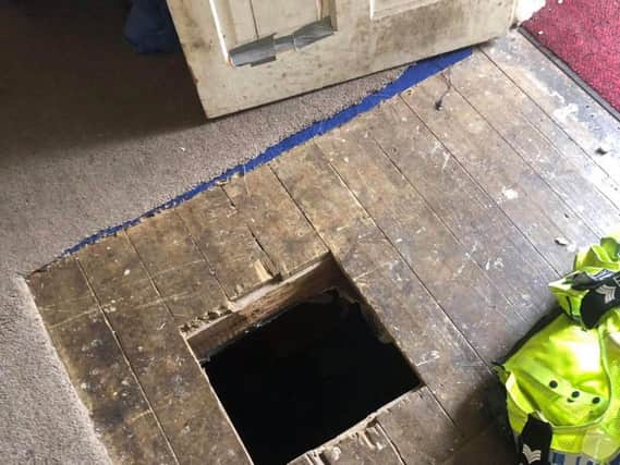 A wanted man who escaped from police by jumping through a DIY bolthole in his house has been arrested. Photo: West Yorkshire Police