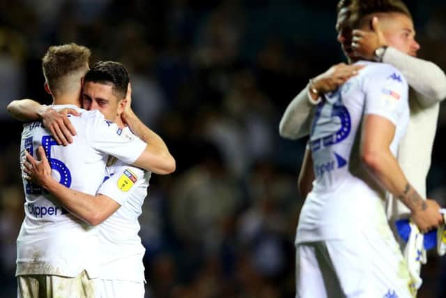 Leeds United players embrace at full-time.