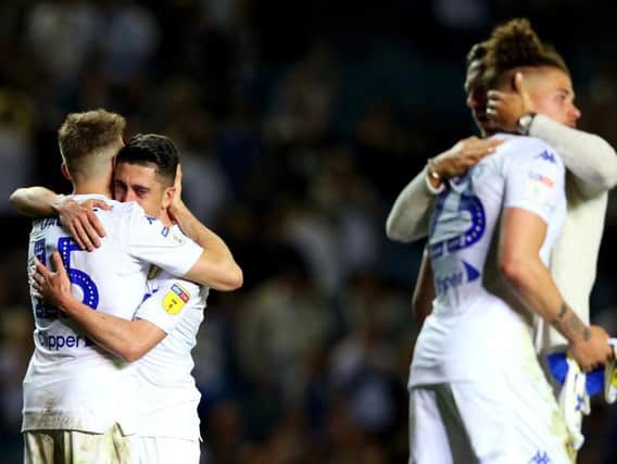 Leeds United players embrace at full-time.