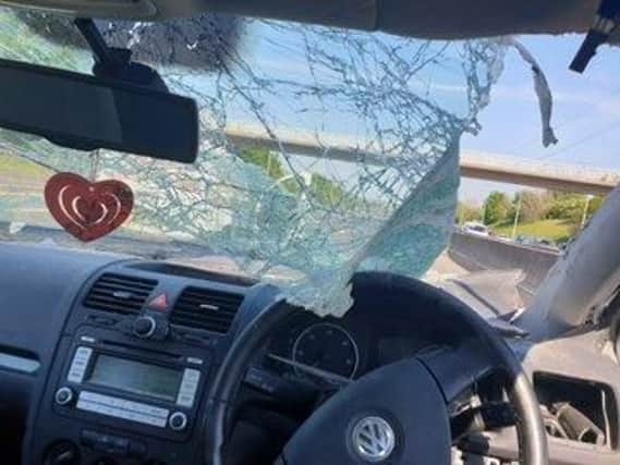 The driver of this car was luckily unhurt after the windscreen was shattered in a lorry crash on the M62 on Wednesday