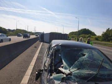 The driver of this car was luckily unhurt after the windscreen was shattered in a lorry crash on the M62 on Wednesday