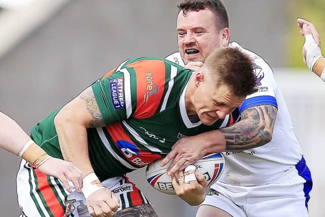 Hunslet's Dan Hawksworth is tackled by Workington's Sean Penkywiecz during the last meeting between the sides.
