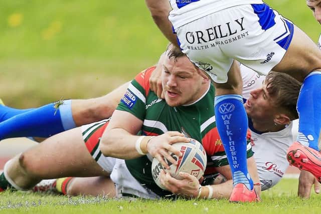 Hunslet's Tom Ashton in action against Workington.