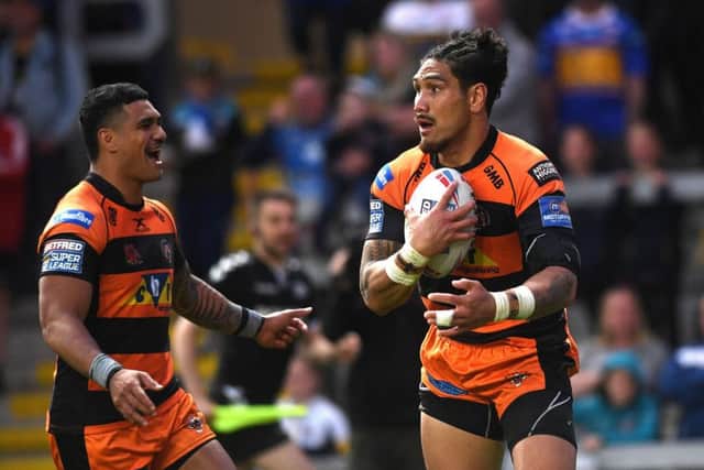 Tigers' Jesse Sene-Lefao celebrates his second try with Peter Mata'utia.