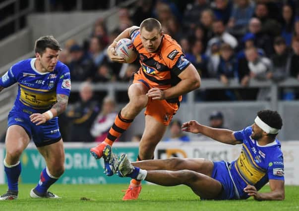 Rhinos' Kallum Watkins can't stop Tigers' Cheyse Blair.   Picture Jonathan Gawthorpe