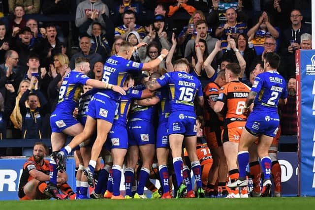 A rare moment of Headingley joy for Leeds joy as Rhinos players mob Matt Parcell after his try.   Picture Jonathan Gawthorpe
