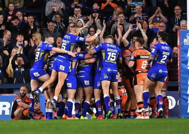 A rare moment of Headingley joy for Leeds joy as Rhinos players mob Matt Parcell after his try.   Picture Jonathan Gawthorpe