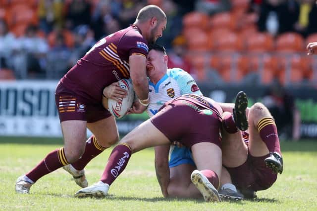 Dewsbury Rams' Callum Field is injured during the Summer Bash game with Batley on Sunday.