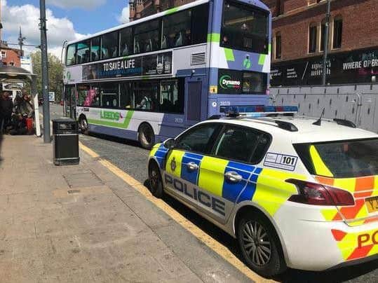 Police at the scene with the bus in New Briggate.